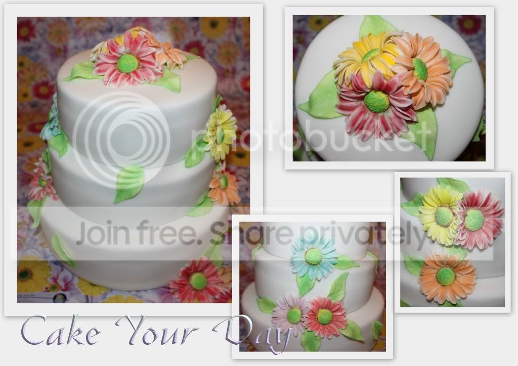 http://i859.photobucket.com/albums/ab151/CakeYourDay/Bruidstaarten%20Wedding%20Cakes/Bruidstaartmetgerberas.jpg